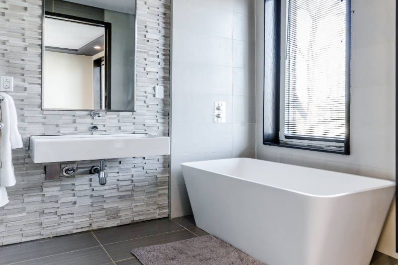 modern style bathroom with tile wall